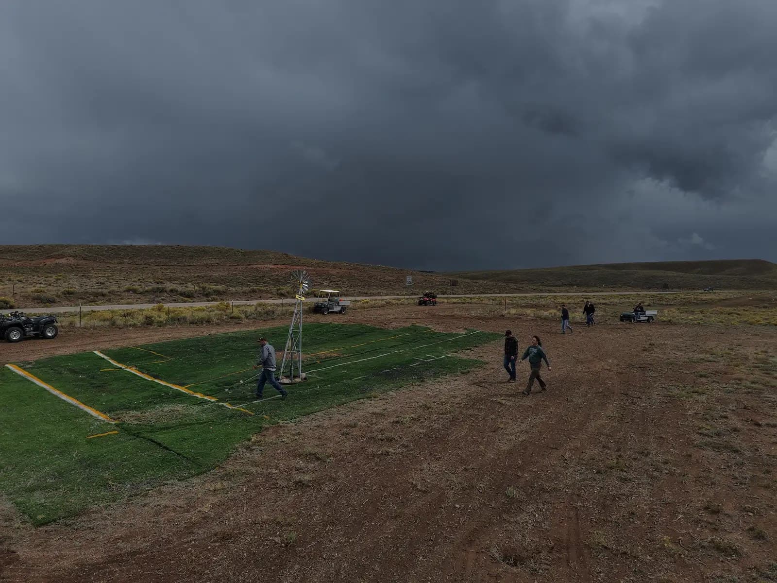Golf cart walkthrough of the fairway build during a passing storm, Sept 2026 retreat