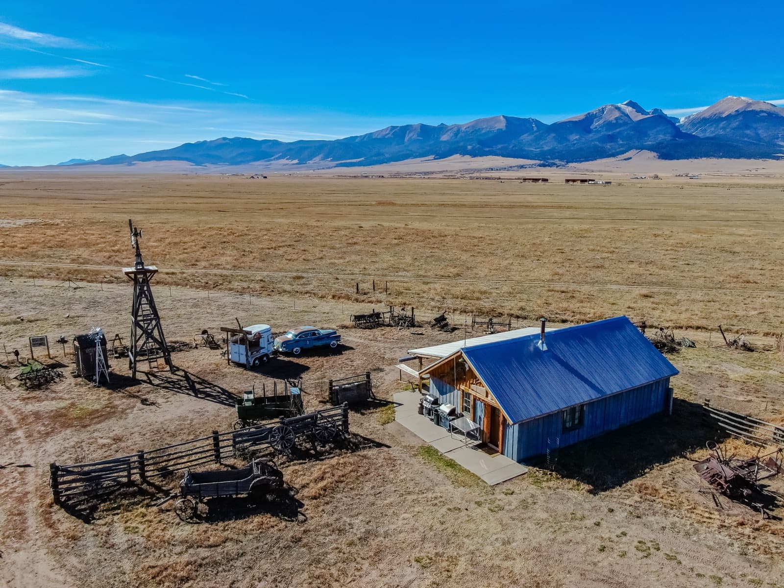 19th Hole aerial view with windmill and Sangre de Cristos