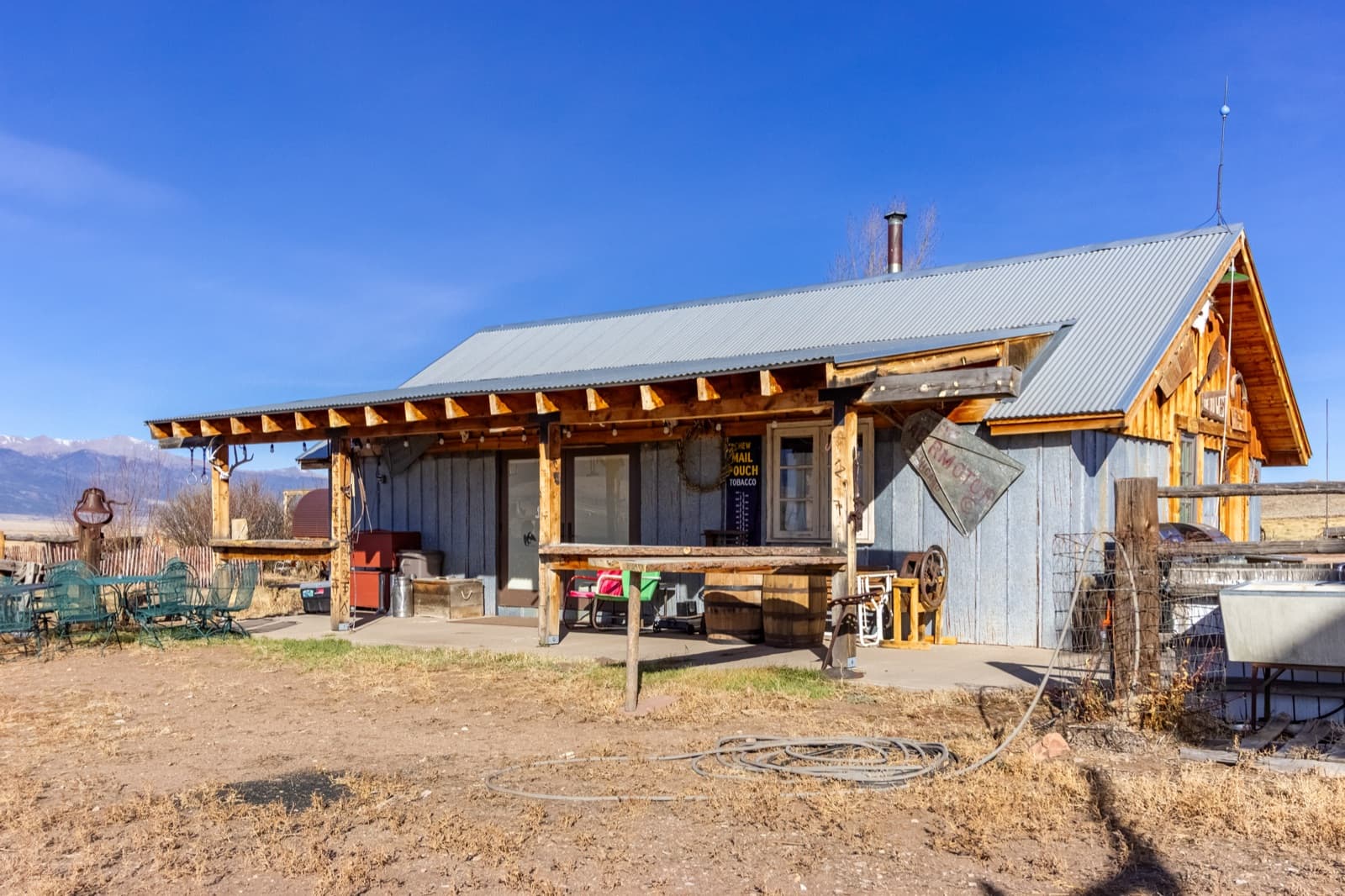 Eva's Bunk House patio exterior with covered porch and mountain views