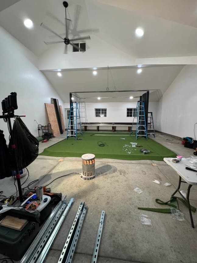 Wide shot of frame + turf footprint relative to the full room width.