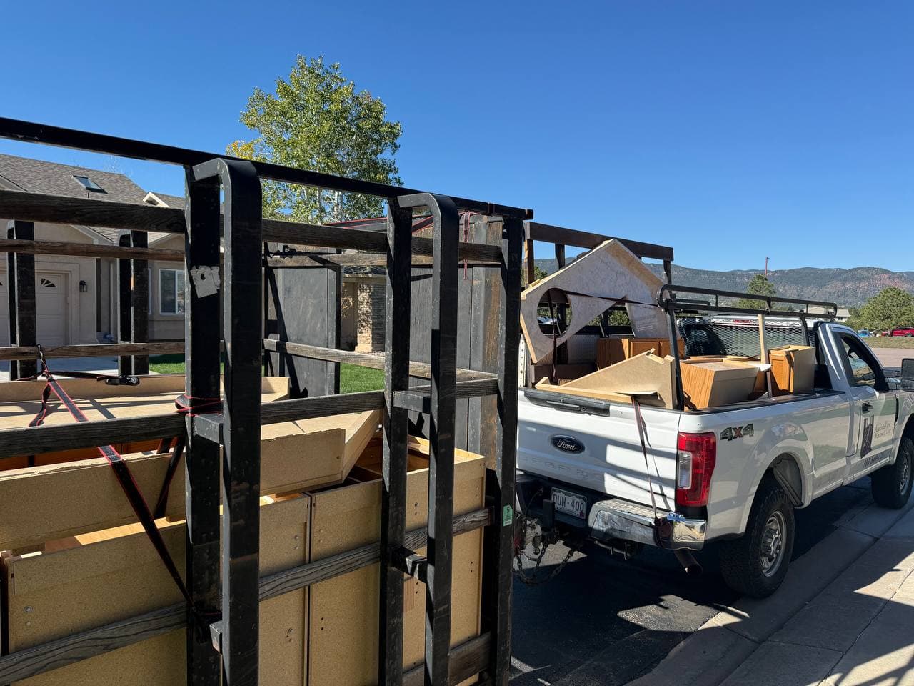 White Mountain View Window & Door service truck loaded with cabinets and trim, strapped down for the haul back to Turkey Toe